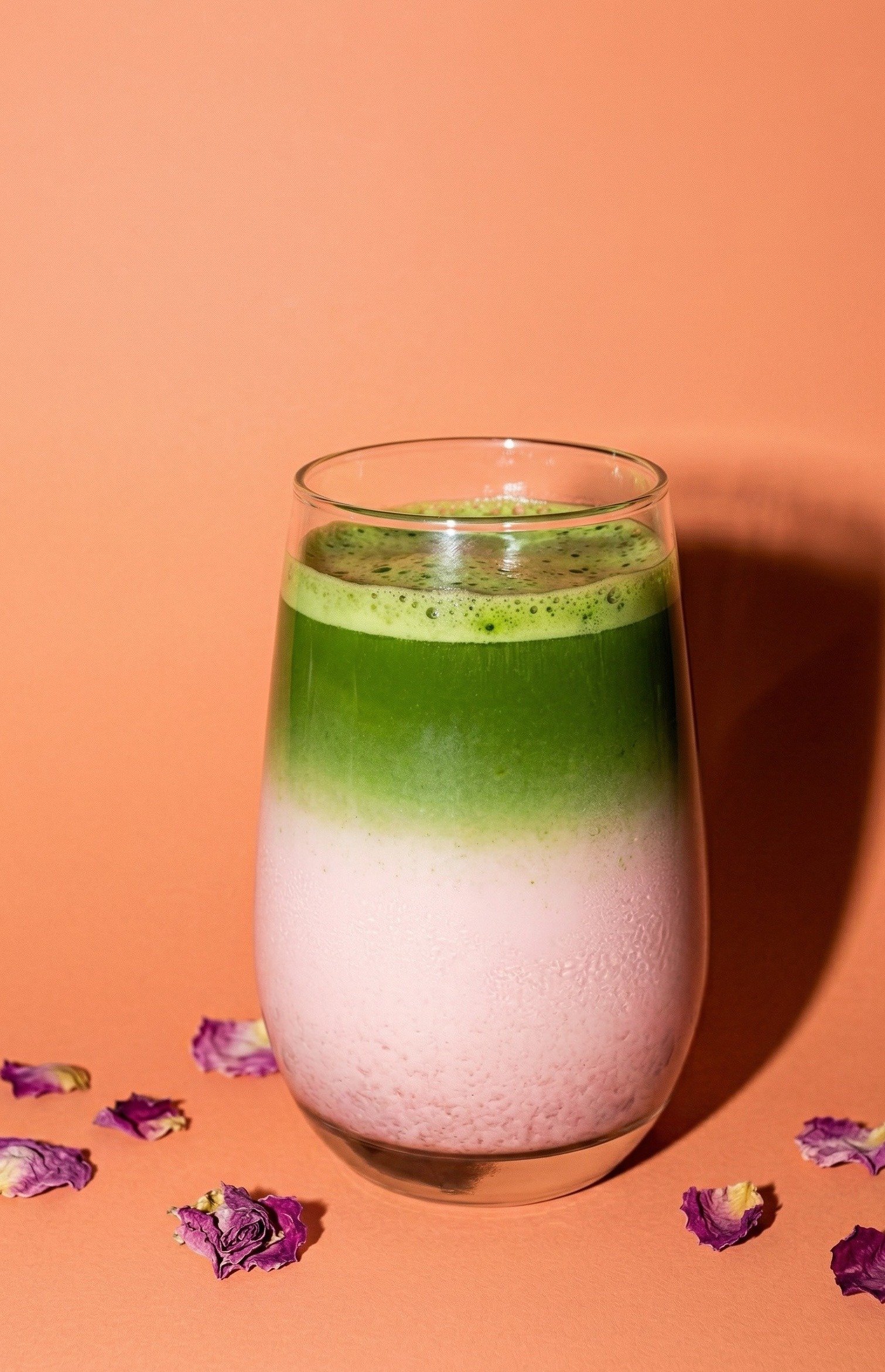 Strawberry Rose Matcha Latte — pink and green layered latte topped with dried rose petals